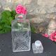 Ice bucket and whiskey decanter made of vintage chiseled transparent glass