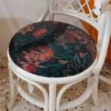 Rattan head-to-head table with vintage armchairs