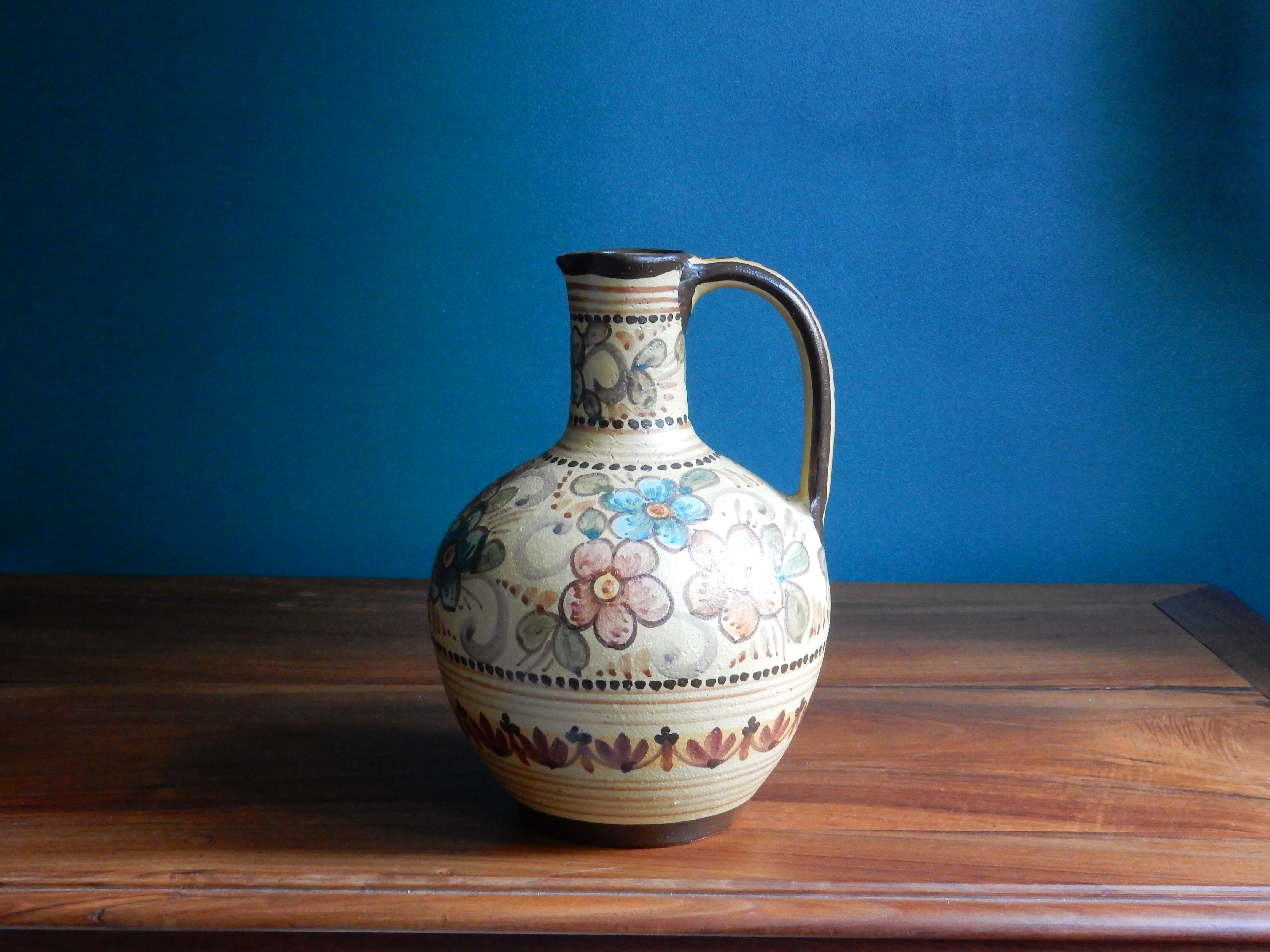 Hand-painted terracotta jug