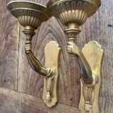 Pair of bronze wall sconces with outstretched arms and hands