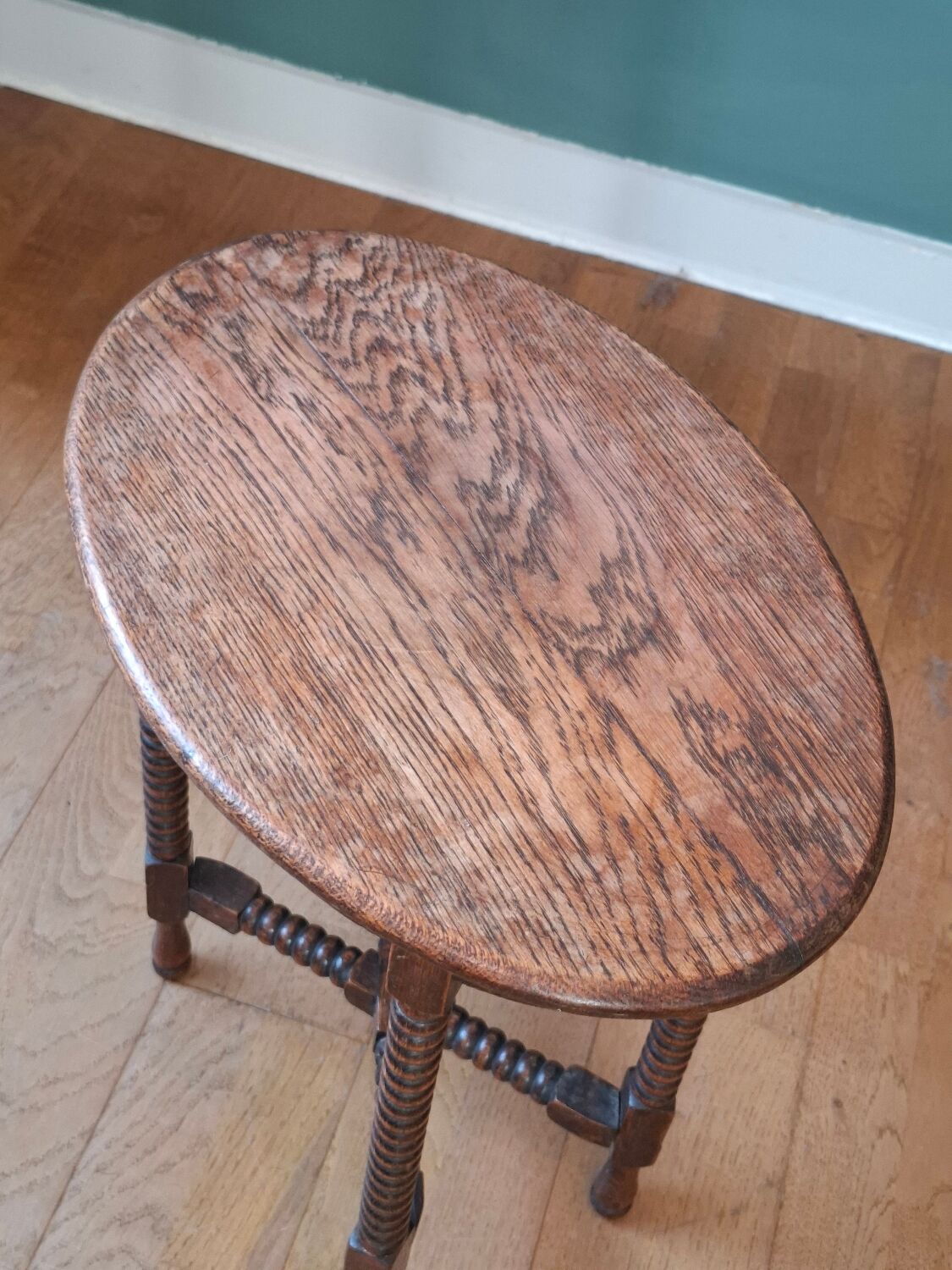 Candle holder side table with spool legs