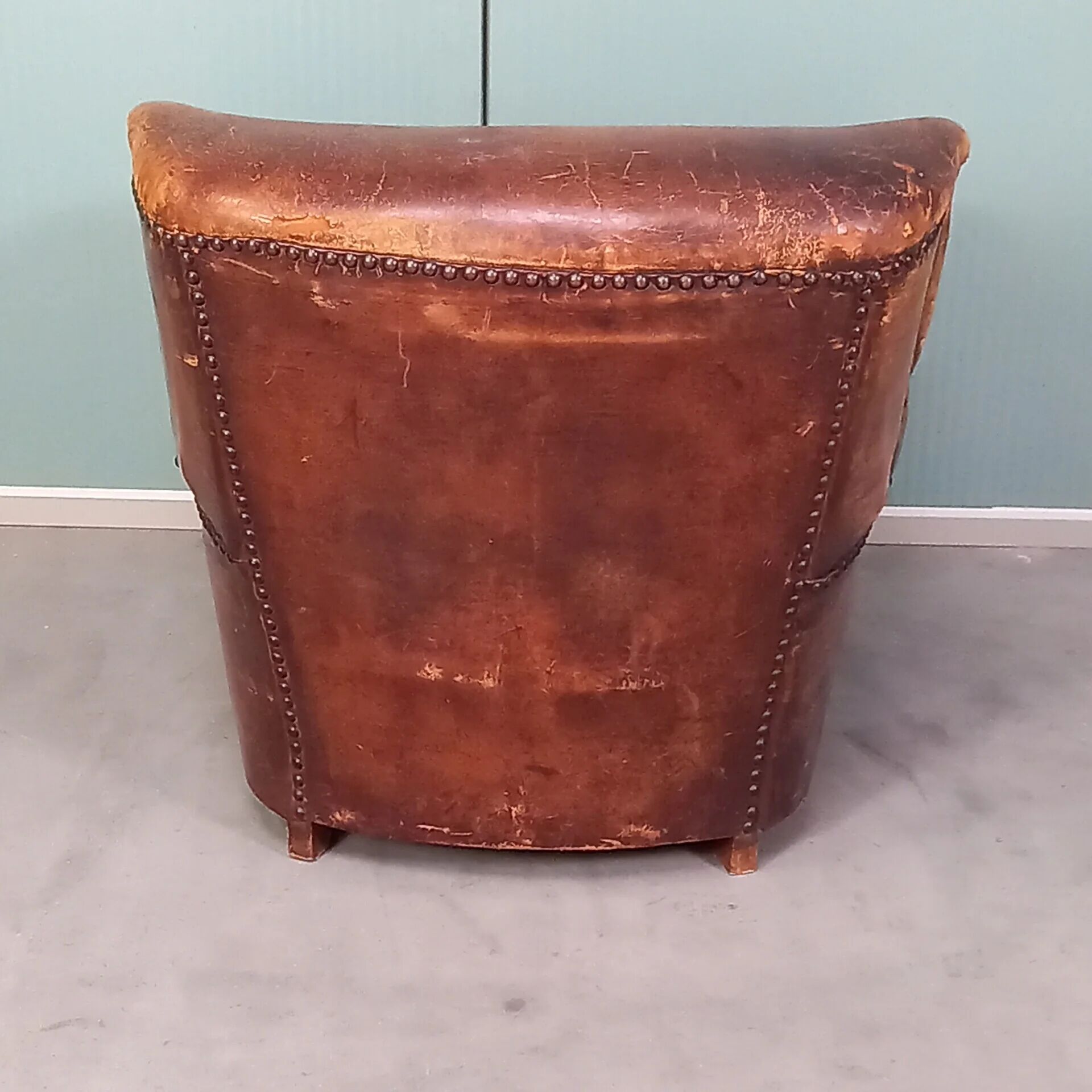 Leather nailed armchair