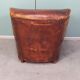 Leather nailed armchair