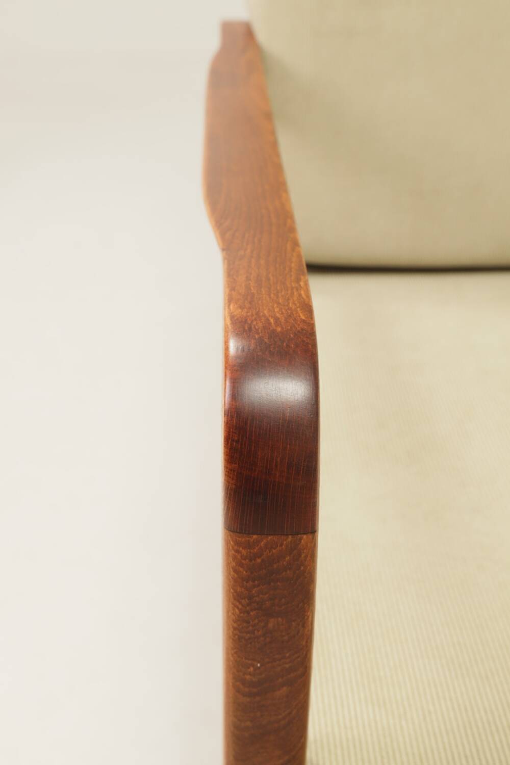 Vintage armchair in olive corduroy with a wooden frame.