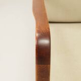 Vintage armchair in olive corduroy with a wooden frame.