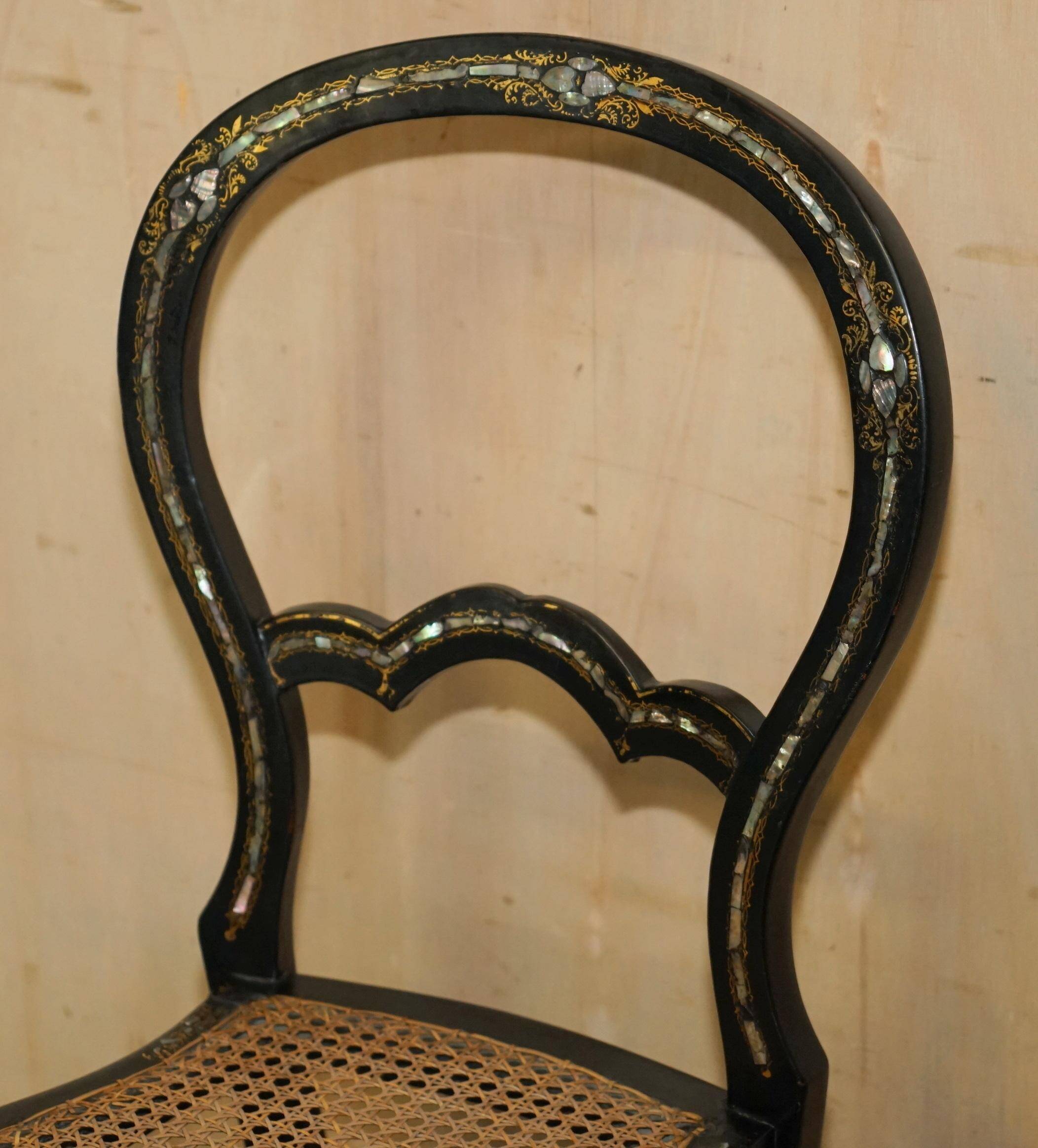 Four antique Regency bergère chairs with mother-of-pearl inlay.