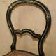 Four antique Regency bergère chairs with mother-of-pearl inlay.