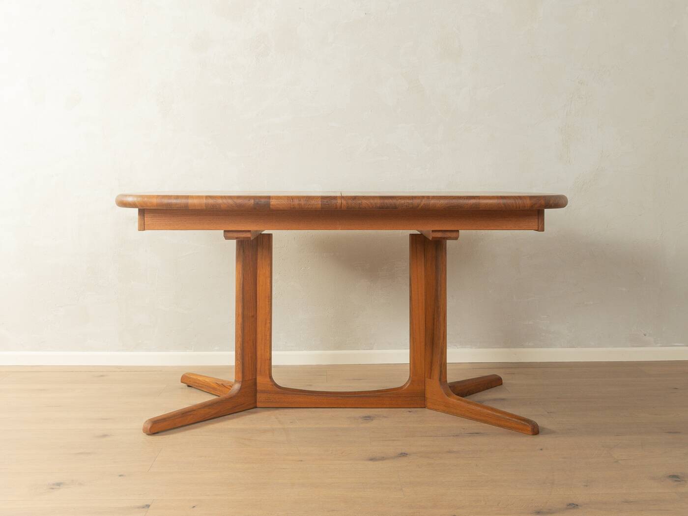 Glostrup dining table, 1980s, solid teak, by Johs. Kristoffersen & Søn, with two extension leaves