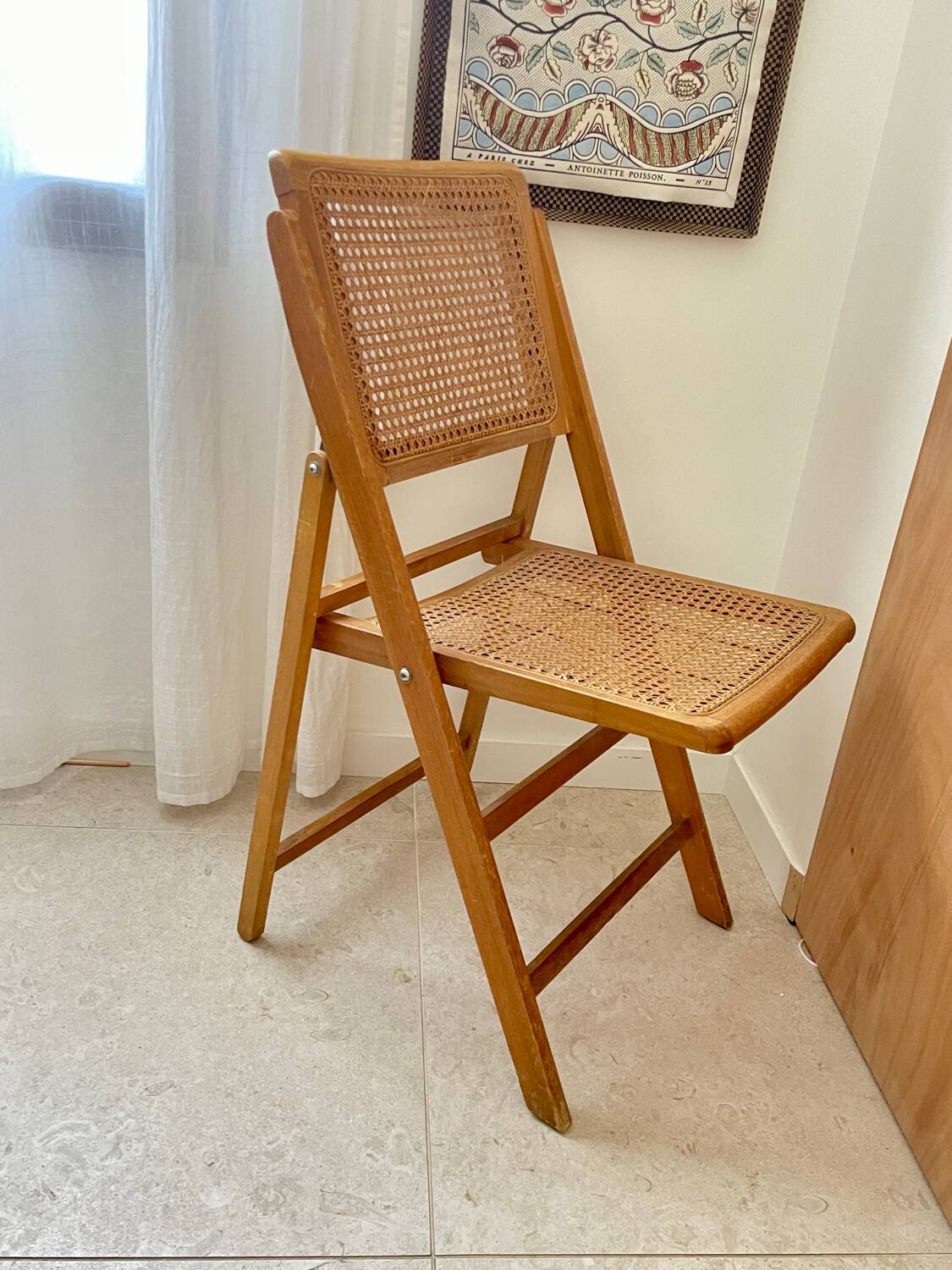 Folding wooden and cane chair