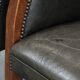 Set of two cowhide and wooden tub chairs with a sturdy colour scheme