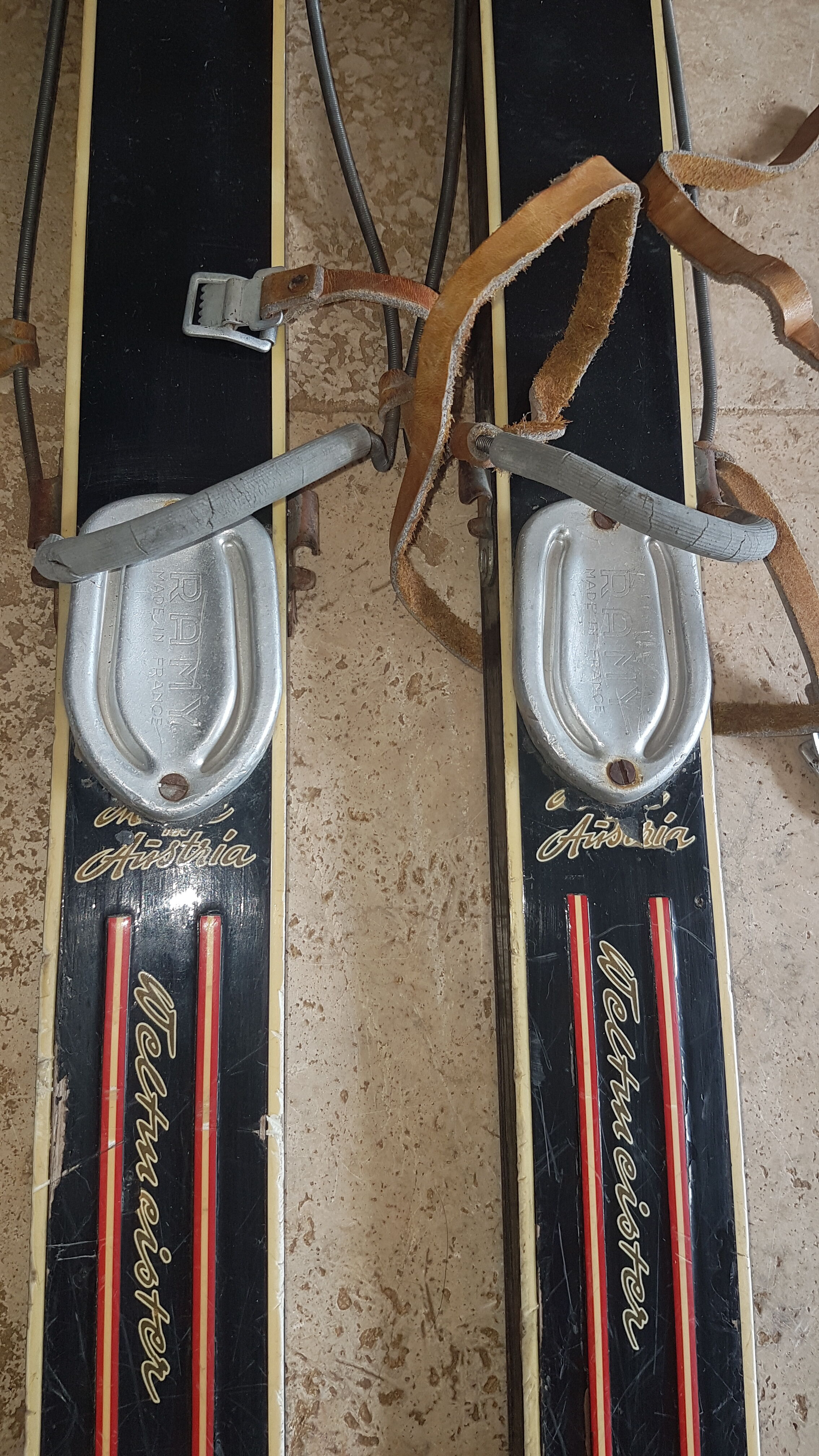 Old skis wooden and its pair of sticks