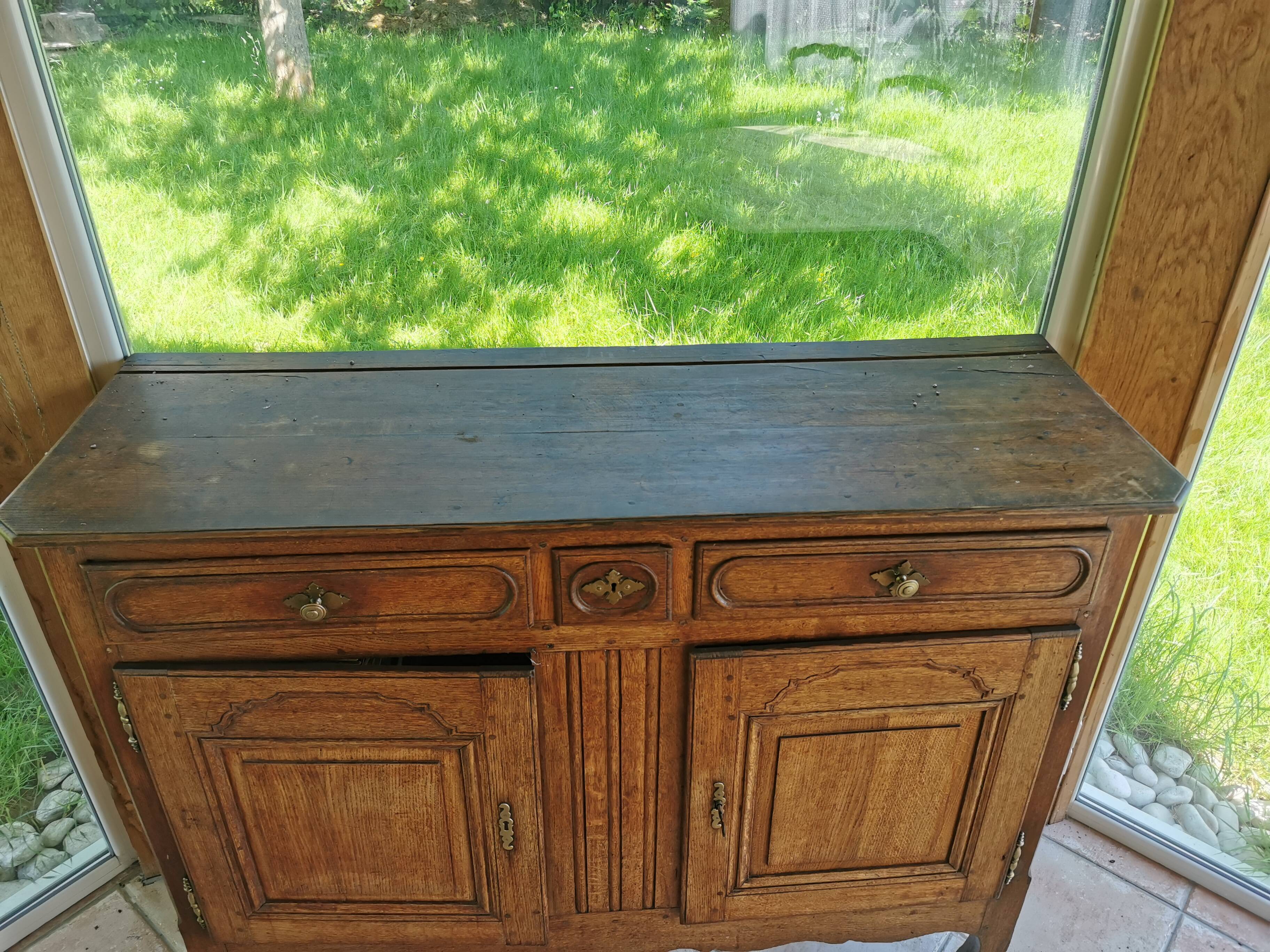 Old low buffet, 19th in rustic solid oak, carved and molded