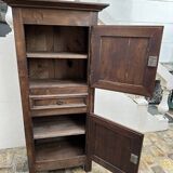 Man - standing - narrow two-door wardrobe with a central drawer