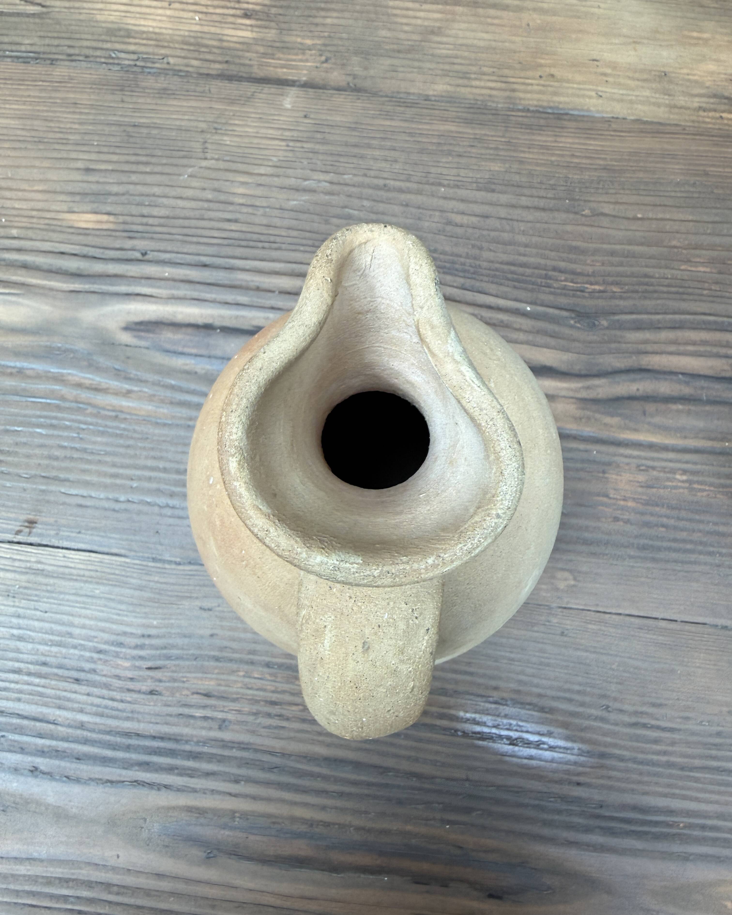 Unfired clay pitcher