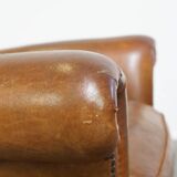 Beautiful and comfortable sheepskin armchair, finished with decorative nailheads