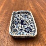Vintage handmade blue ceramic ashtray with deer and flower ornament from Rodos Ceramics.