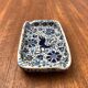 Vintage handmade blue ceramic ashtray with deer and flower ornament from Rodos Ceramics.