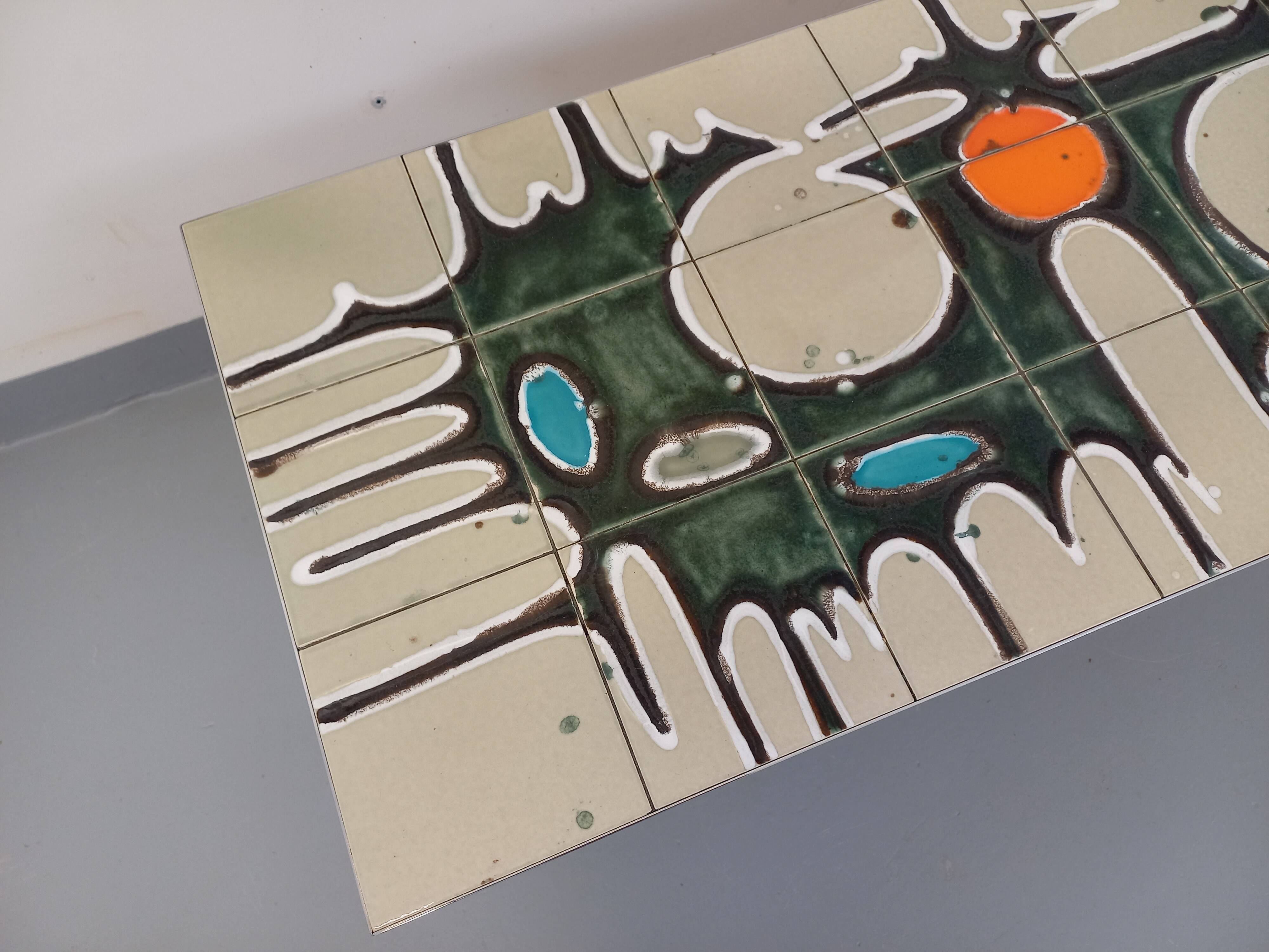 Vintage coffee table from the 60s and 70s in ceramic, chrome metal, and wood.