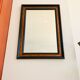 Old wall mirror 72 x 52 cm in black wood and faux mahogany