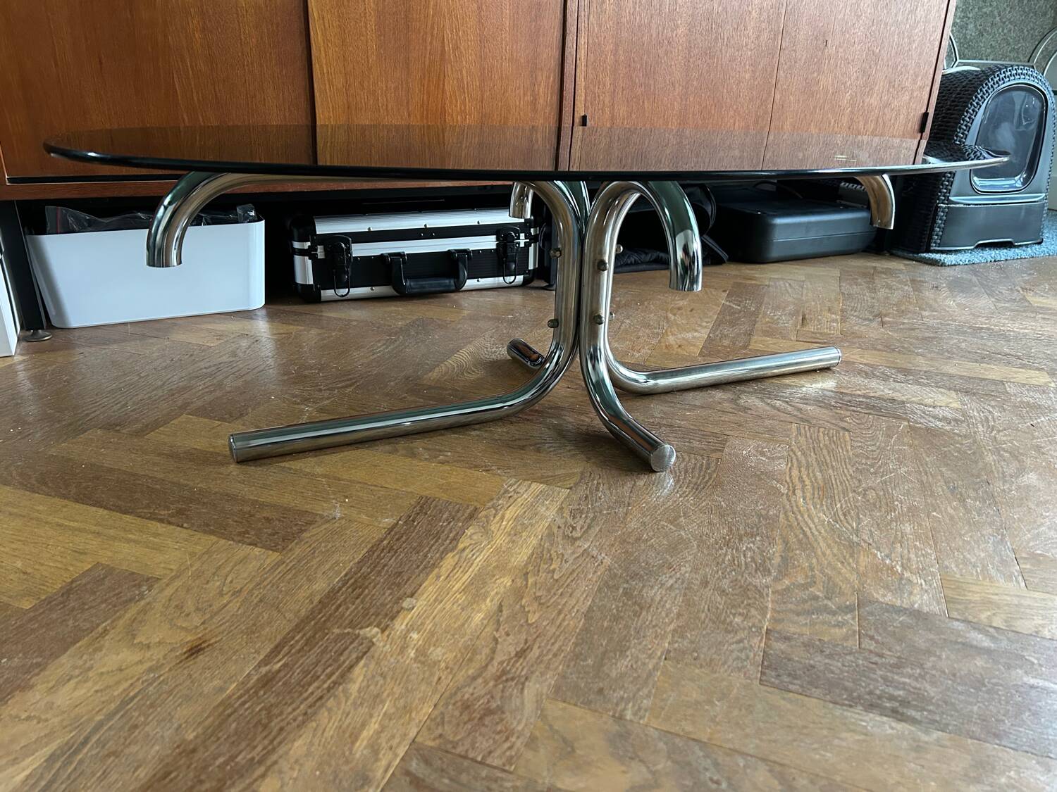 70s design oval coffee table in smoked black glass with chrome legs.