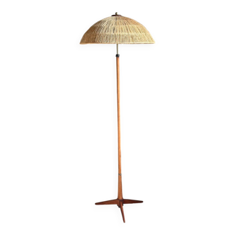 Scandinavian tripod reading lamp in teak and brass.