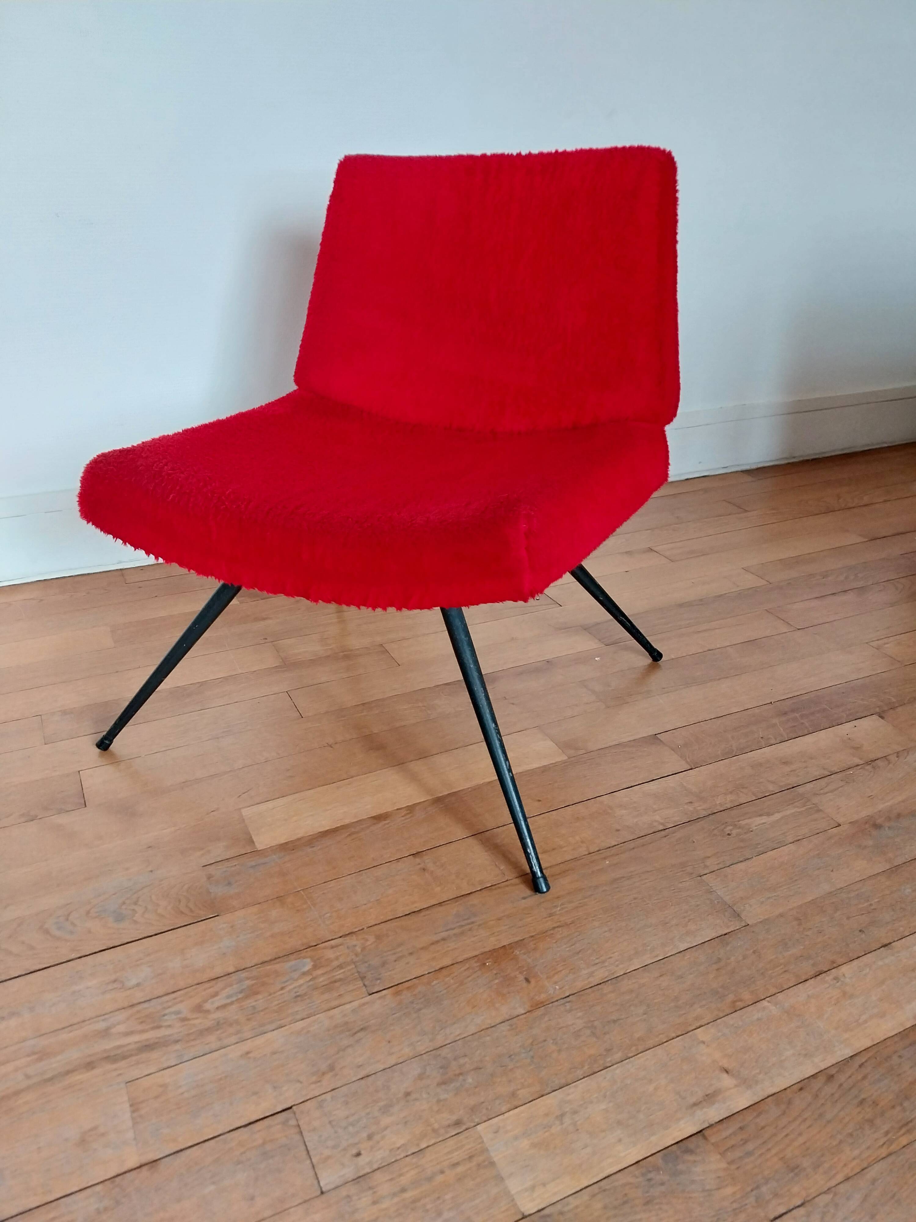 Vintage red faux fur armchair with black metal legs.
