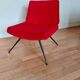 Vintage red faux fur armchair with black metal legs.