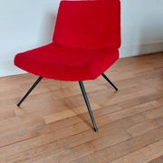 Vintage red faux fur armchair with black metal legs.