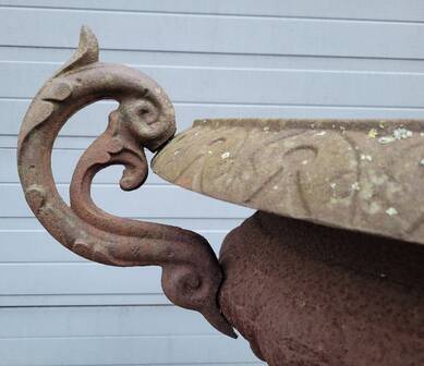 Cast iron garden urn on pedestal with handles