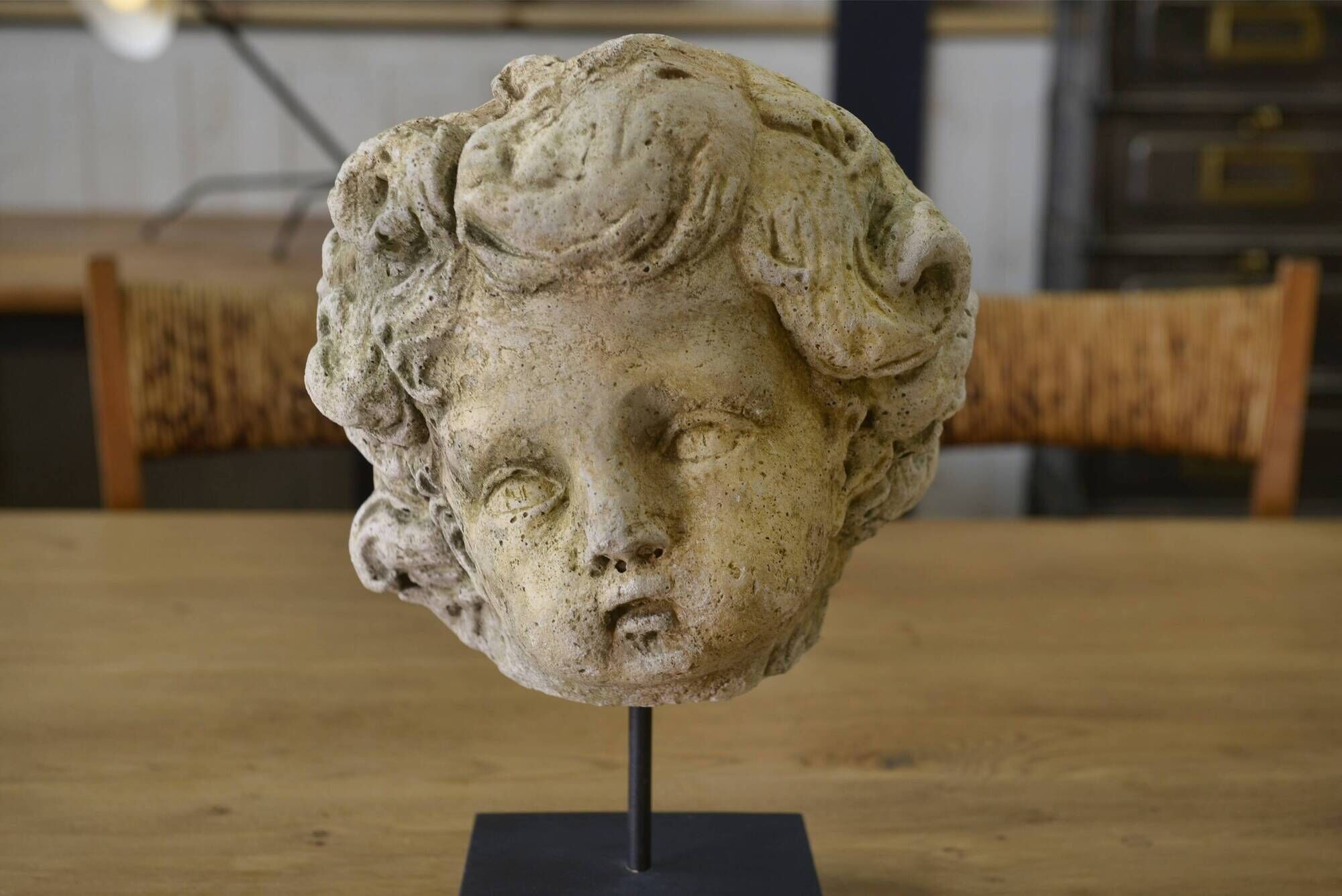 Reconstituted stone sculpture in antique style from the 20th century.