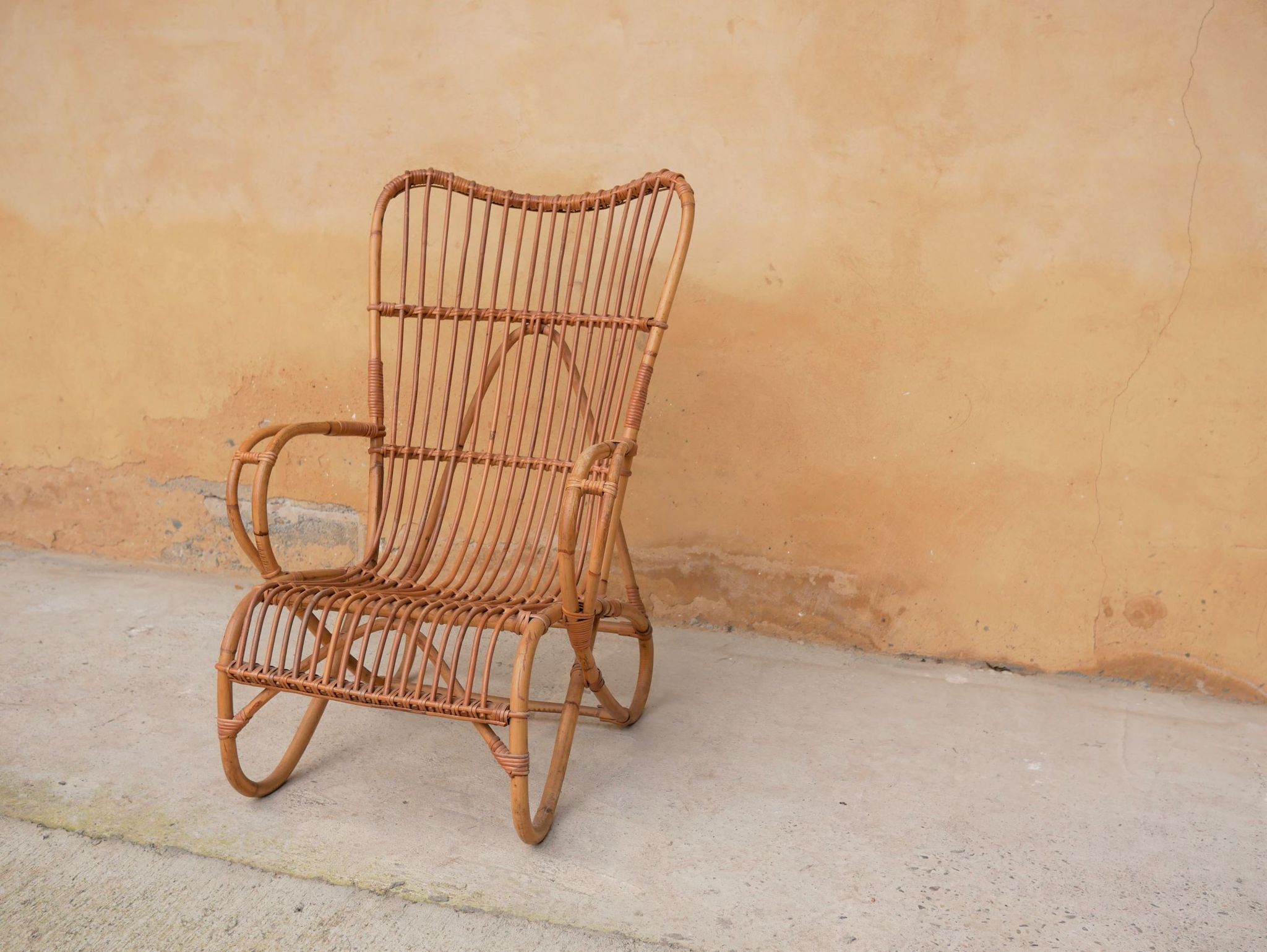 Vintage rattan chair by Louis Sognot