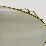 Elegant wall mirror in brass and black from the mid-century, Italy, 1950s.