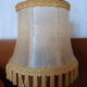 Brass bedside lamp with natural bladder shade.