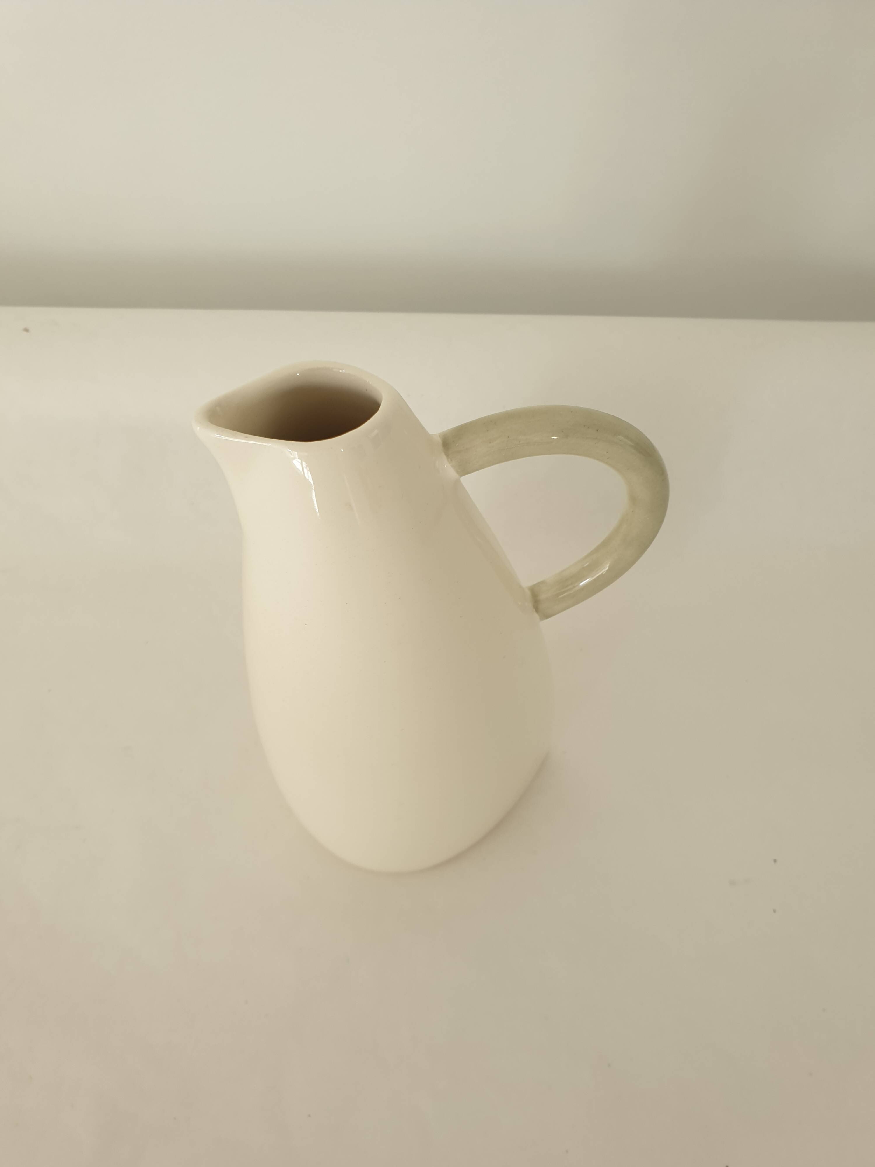 White earthenware pitcher signed KG Lunéville