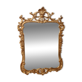 Golden wooden mirror in Louis XV style