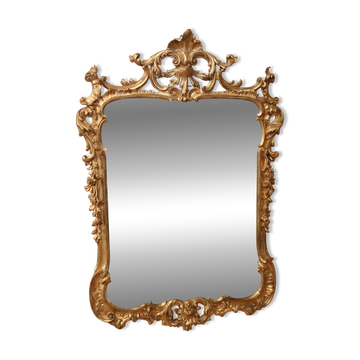 Golden wooden mirror in Louis XV style