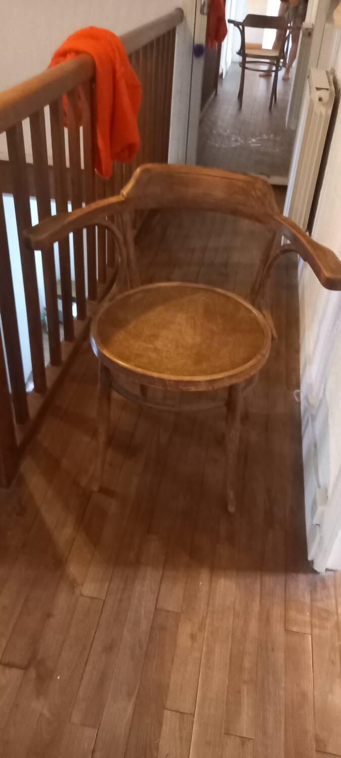 Curved wood armchair