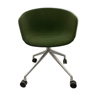 Green office chair on casters