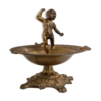 Vintage brass ashtray from the 1940s with a nude boy figurine on a footed base.