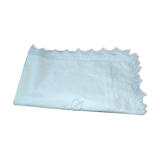 Ancient monogrammed pillowcase adorned with cotton lace