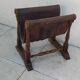 Vintage magazine rack in oak and antique leather