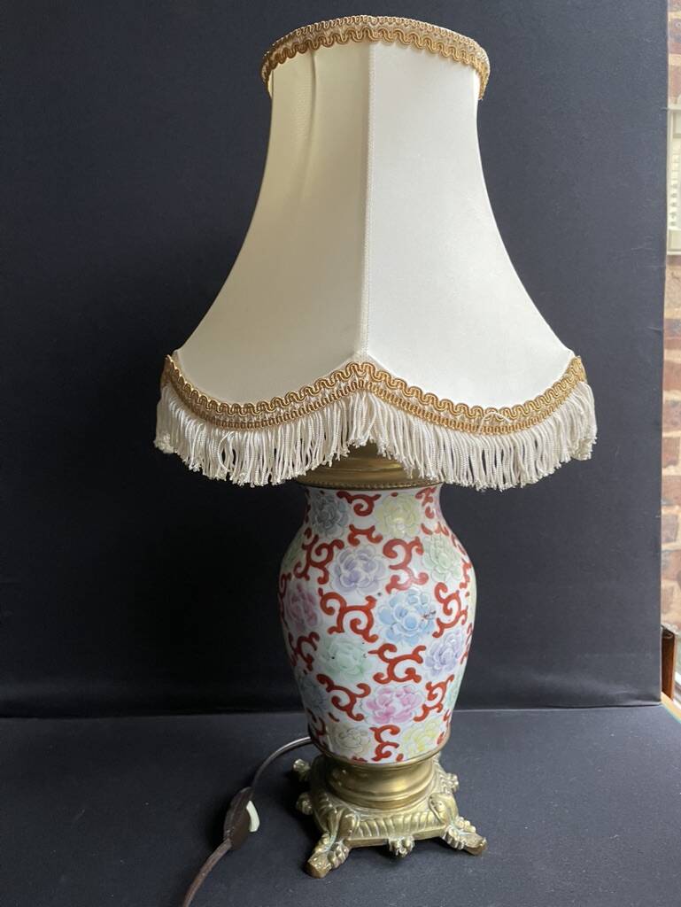 Old Asian vase mounted as a lamp with pagoda lampshade