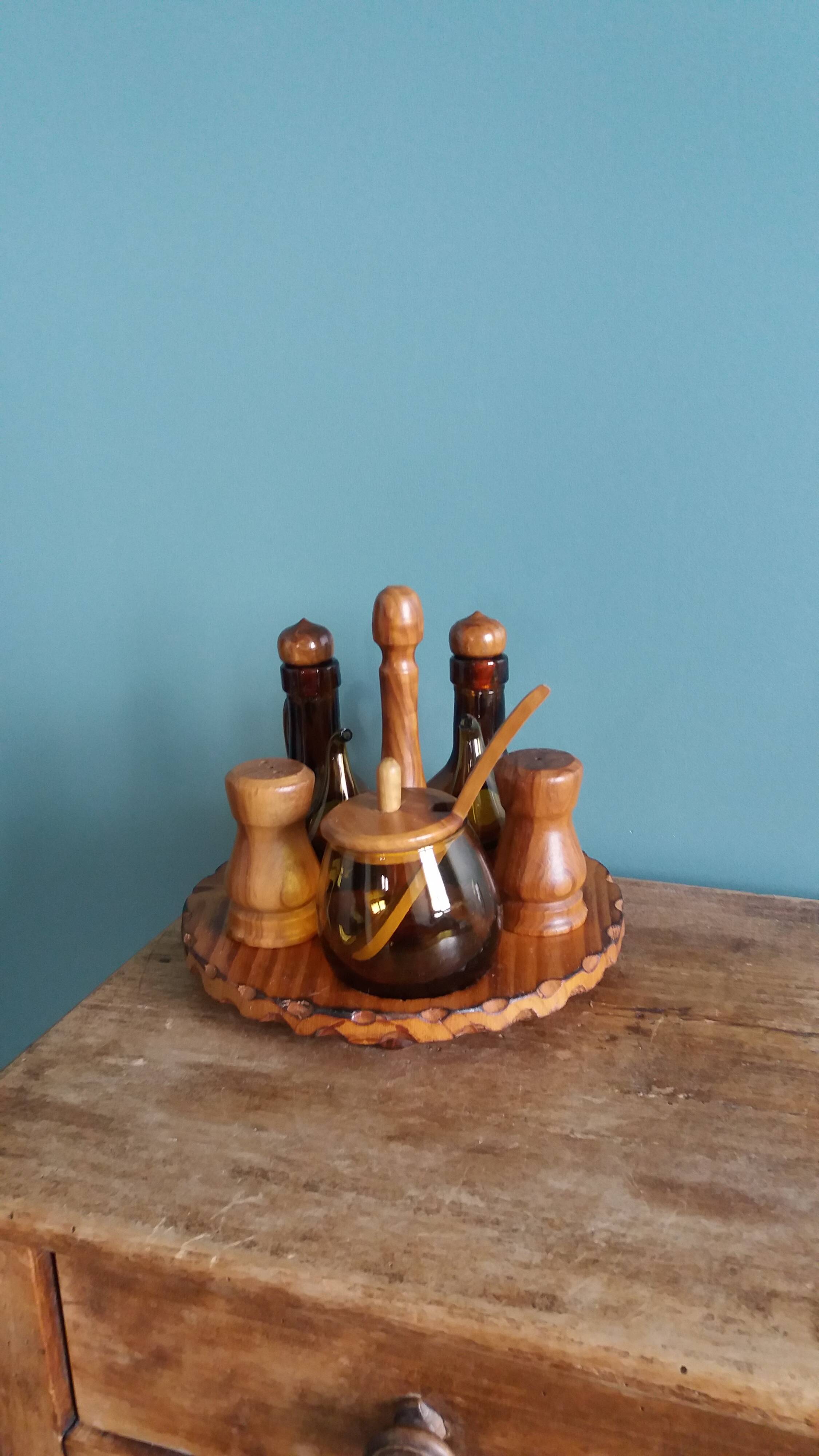 Oil, vinegar, mustard, pepper, salt, olive wood servant from Spain.