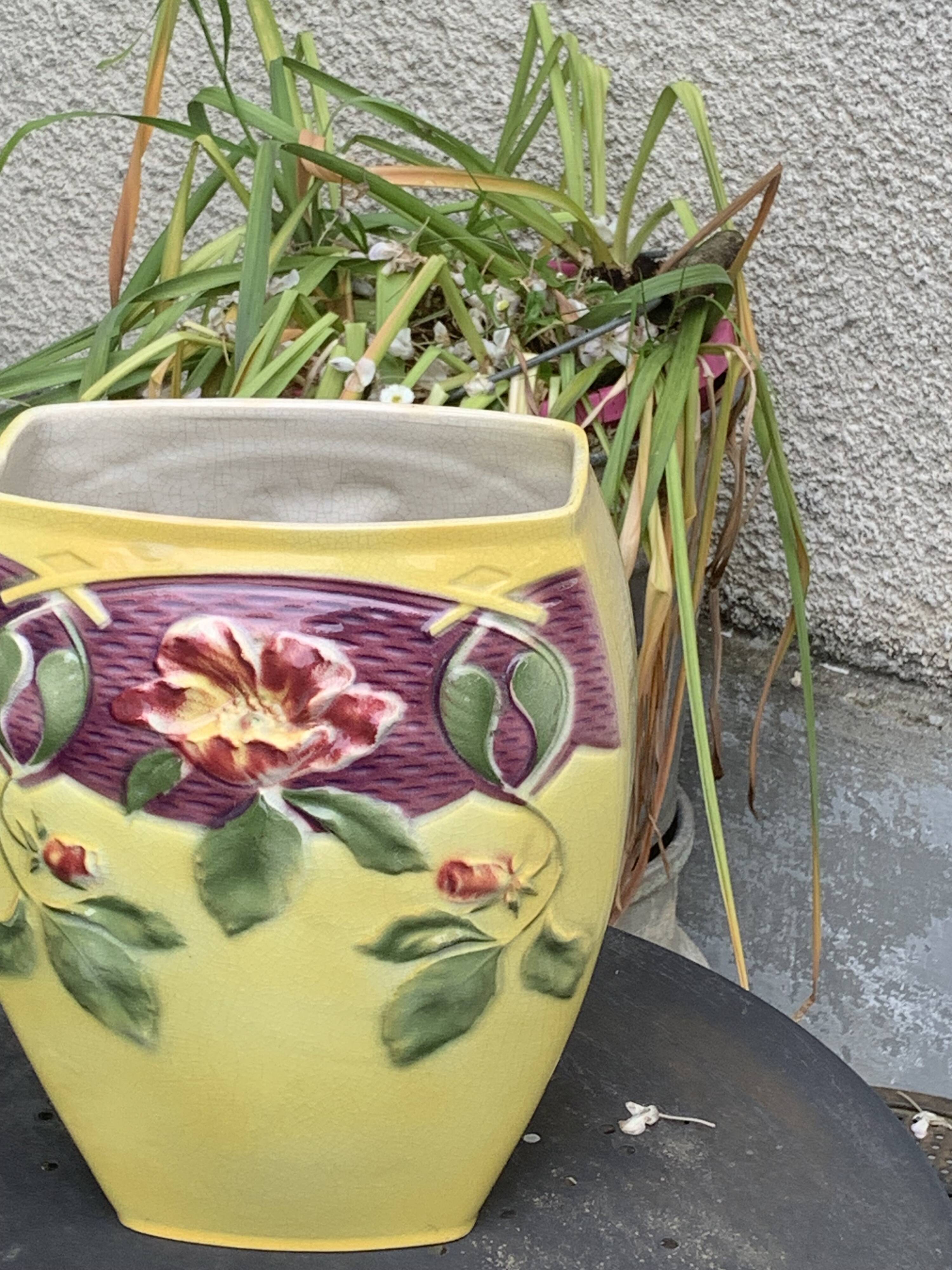 Yellow glazed ceramic slip vase with hawthorn pink flower motif