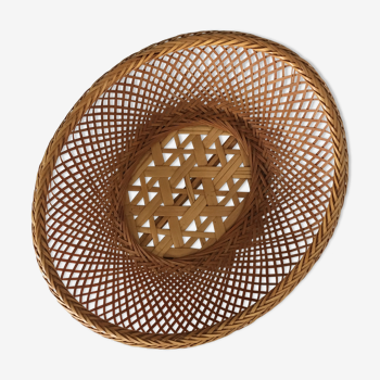 Braces of wood and woven rattan oval basket