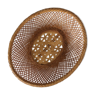 Braces of wood and woven rattan oval basket