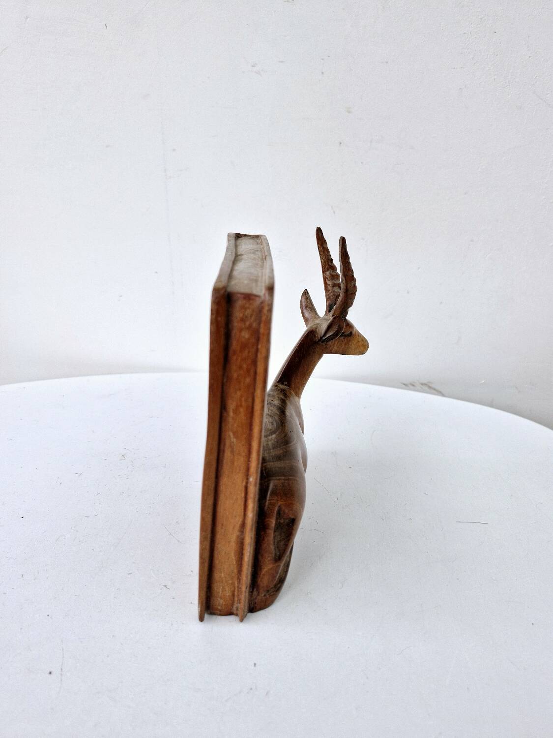 Old antelope bookend in hand carved wood