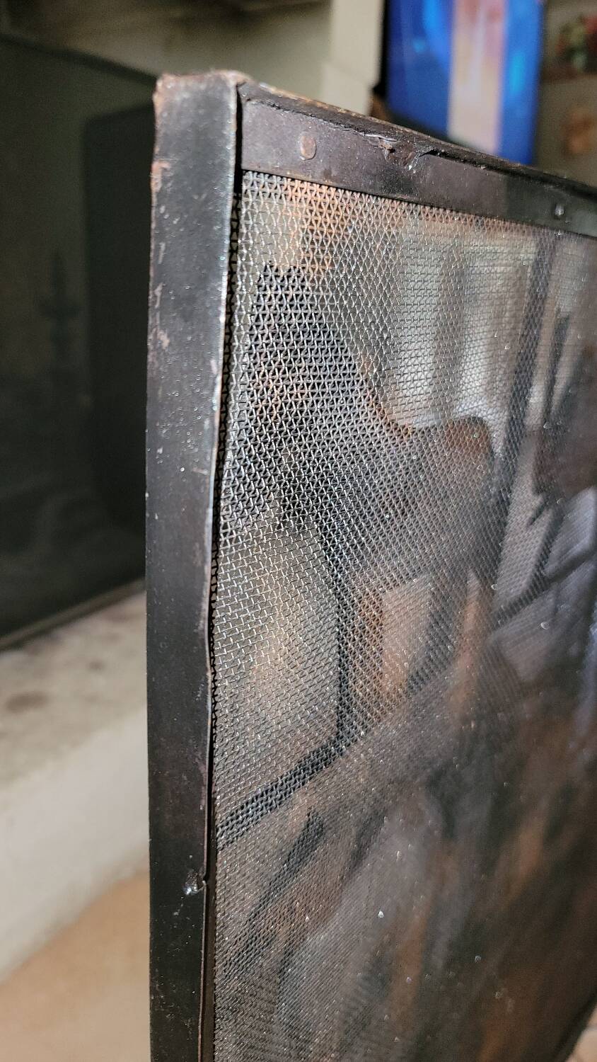 Black metal firewall decorated with animals