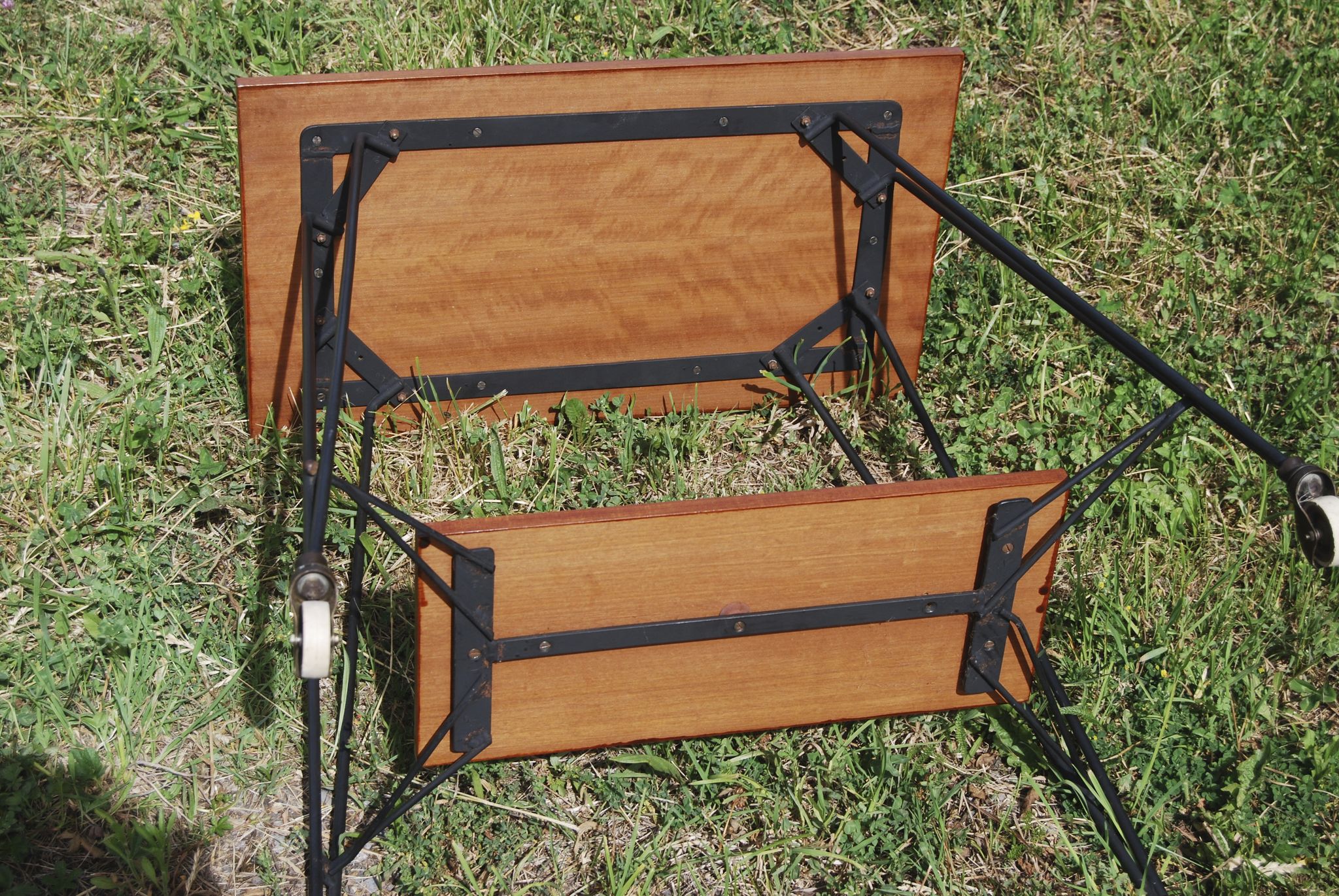 Tv furniture, a table with teak wheels and Scandinavian-style metal.