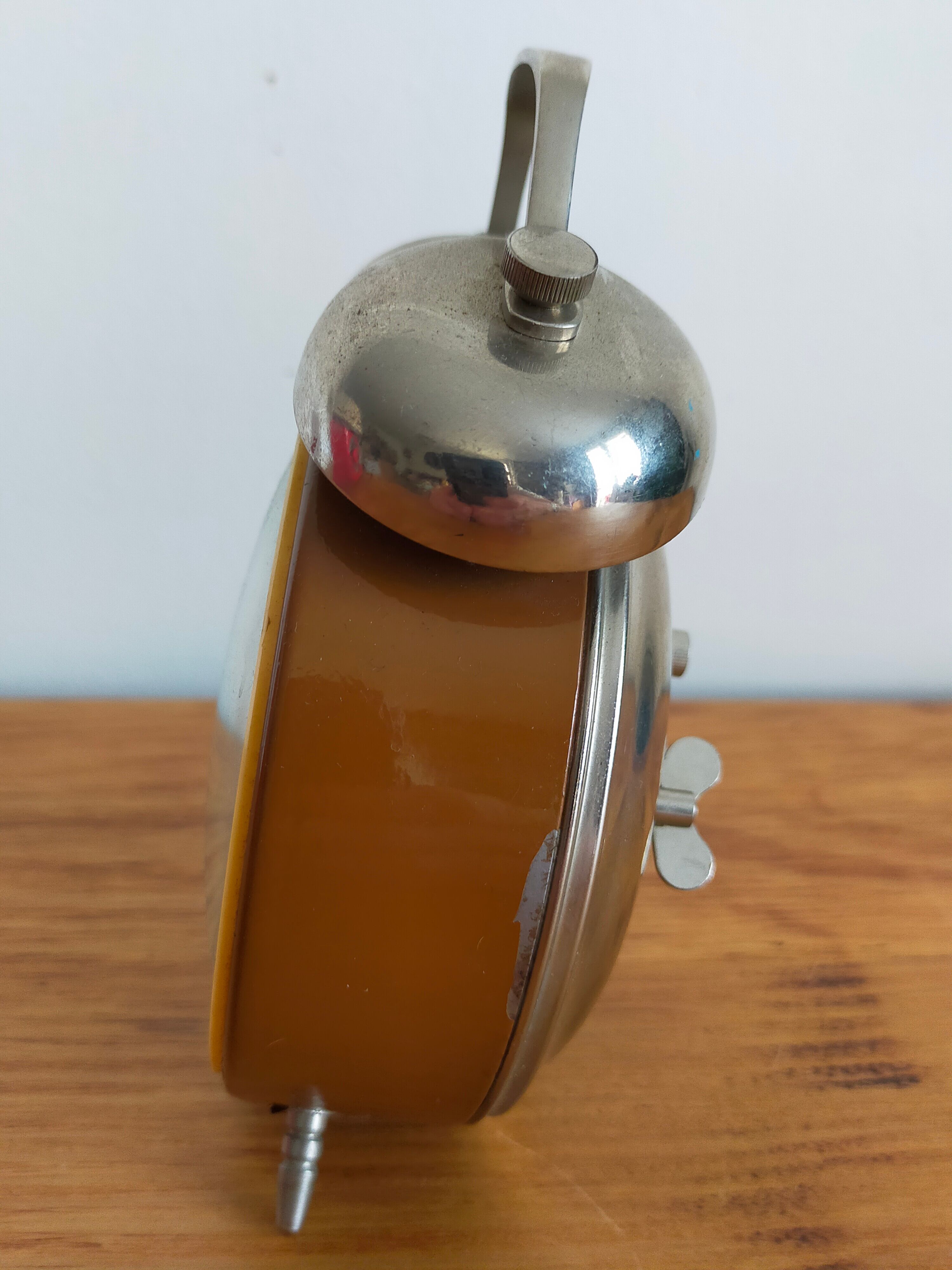 Vintage brown and silver mechanical alarm clock